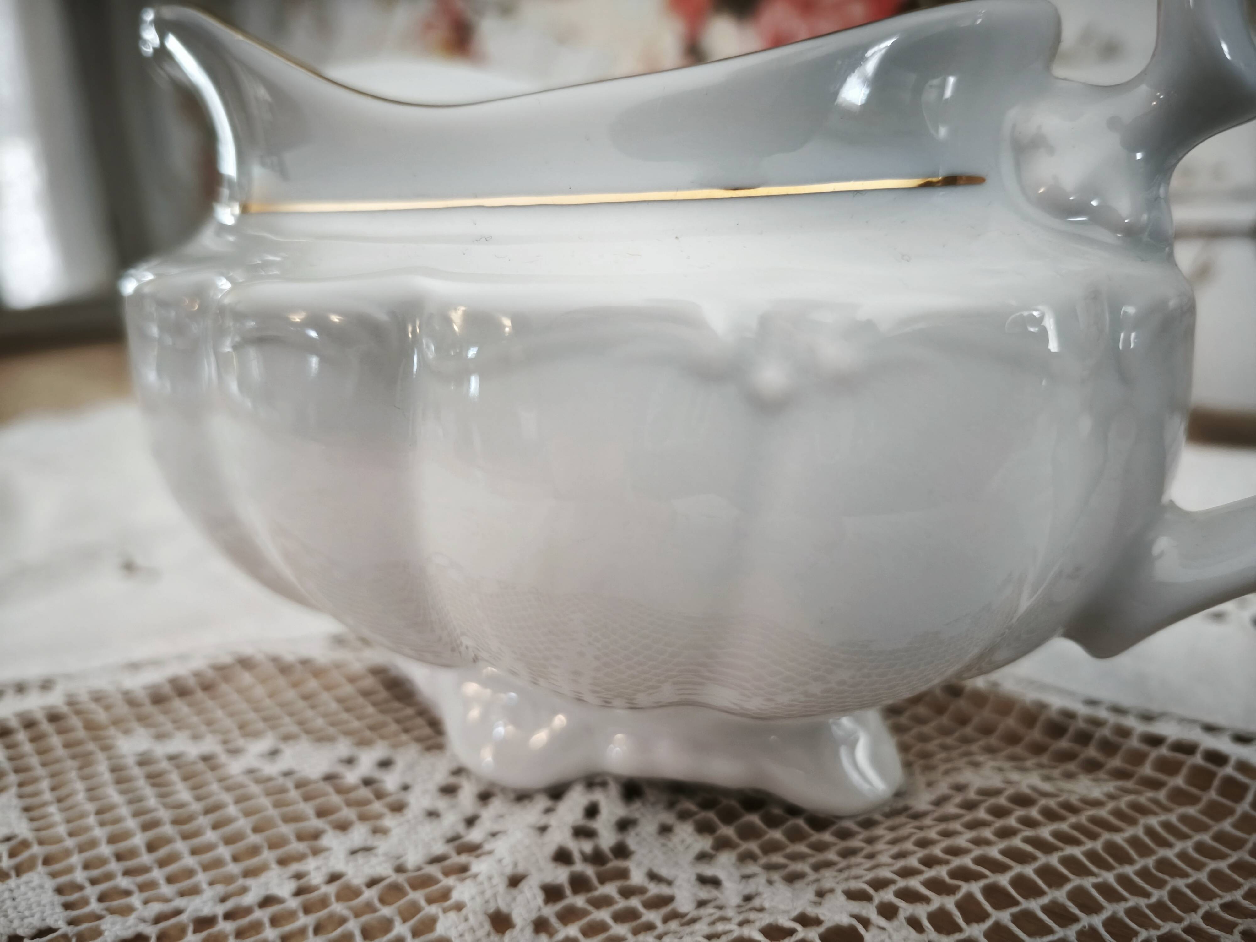 Porcelain sauceboat, white manufacture with double gold line, hand-painted.