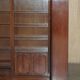 Corner library made of flamed hardwood, in 3 parts.