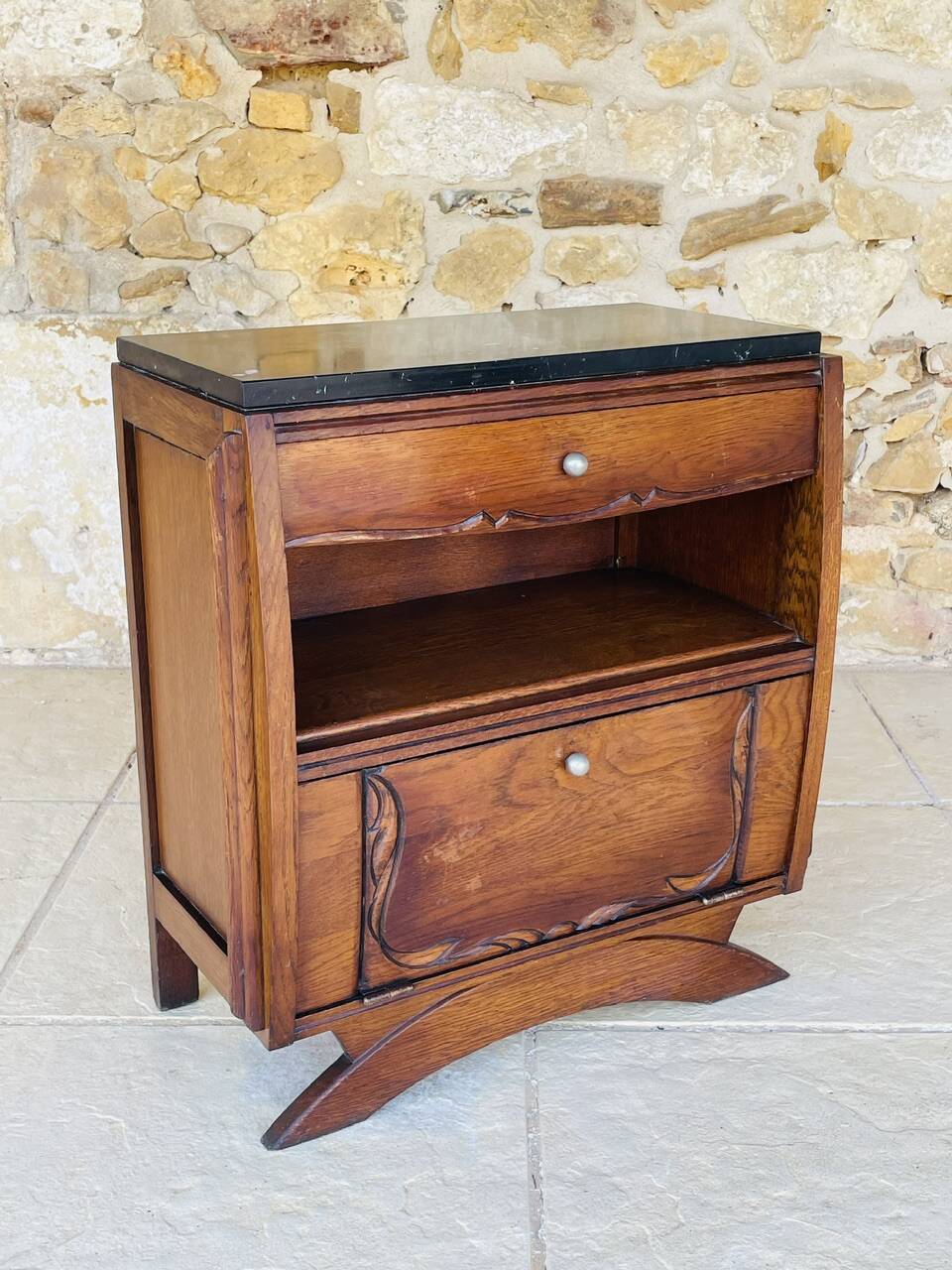 Art Deco bedside table in walnut, black marble top, circa 1920.