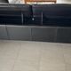 Two-seater black leather sofa Roche Bobois