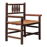 Wicker armchair in solid wood, handcrafted, France, around 1950.