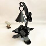 Handcrafted black wrought iron candle holder with its vintage extinguisher