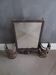 Art Deco wall-mounted brush holder mirror in wrought iron.