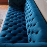 Royal blue velvet upholstered sofa