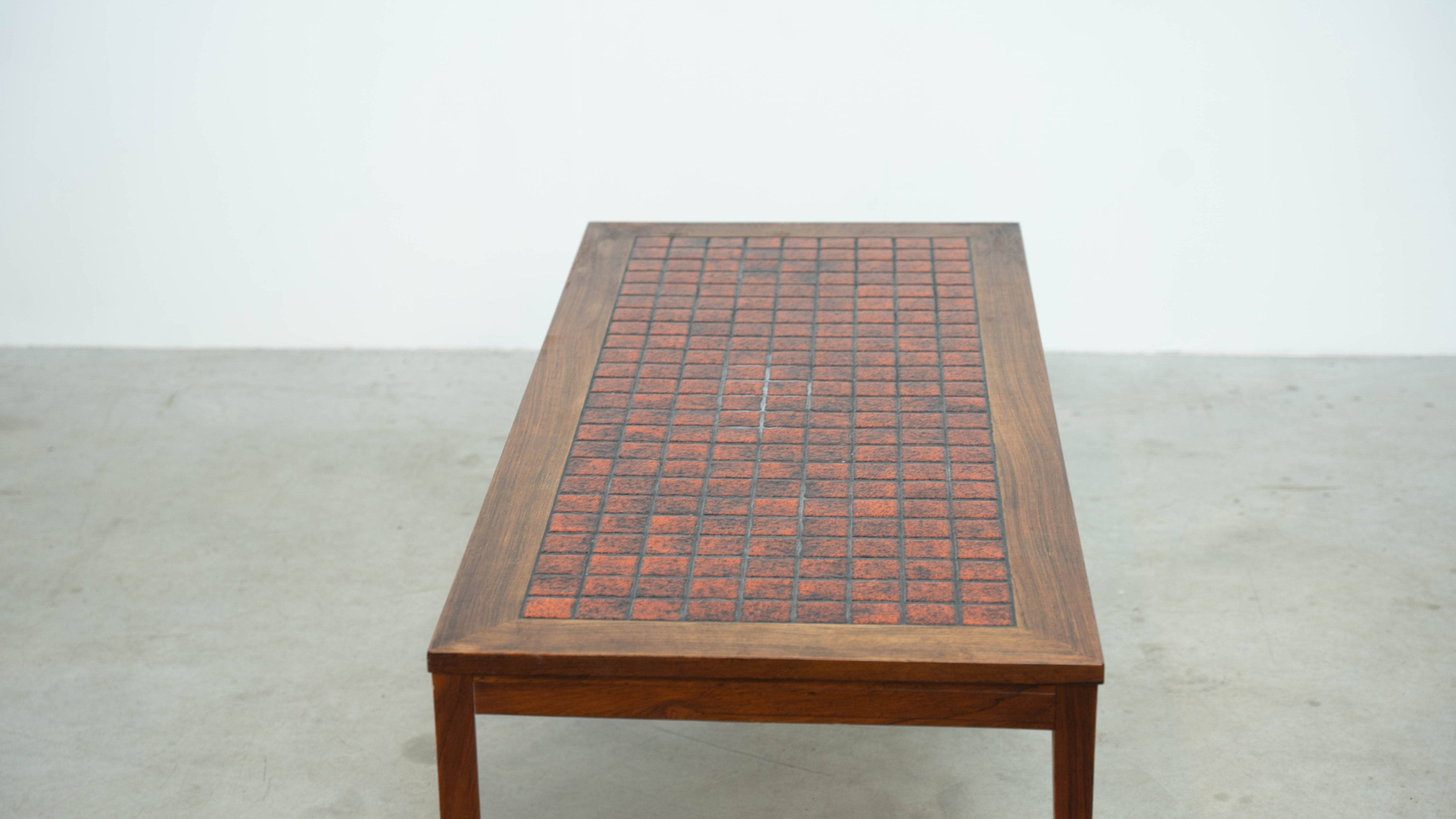 Danish red ceramic and teak coffee table