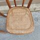 Pair of vintage bistro chairs in curved wood and caning.