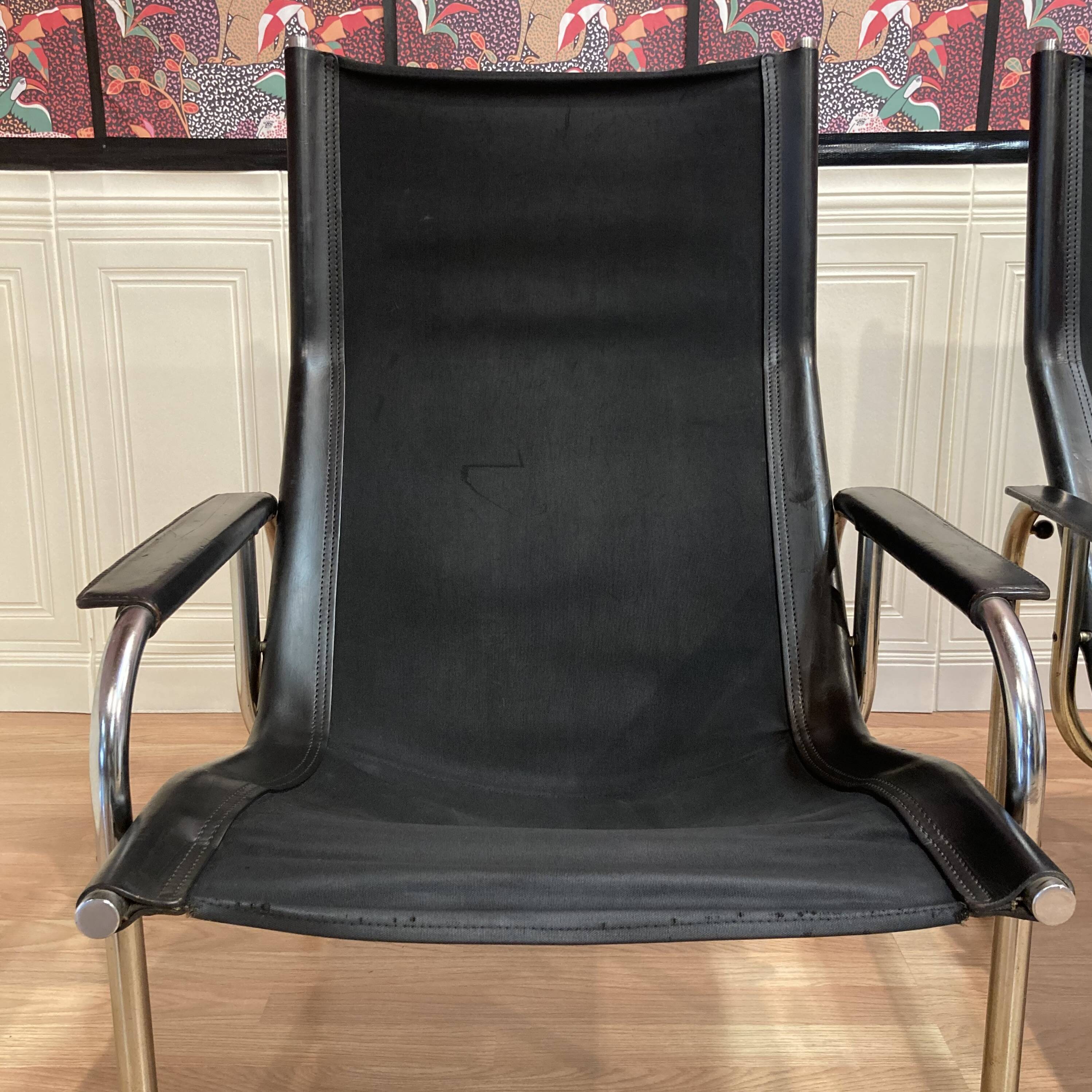 Reclining armchair in black leather and chrome design "hans eichenberger" 1960.