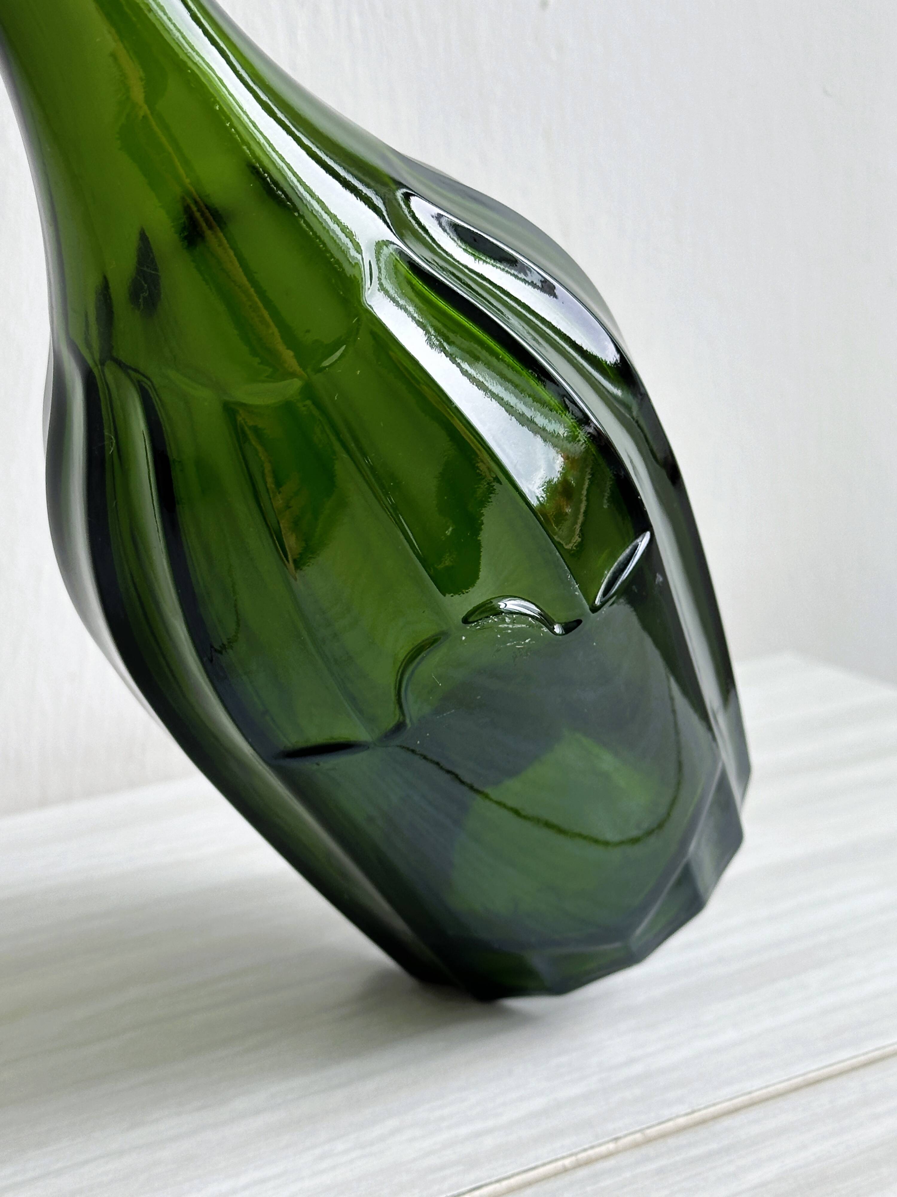 Translucent green glass bottle, classic design.