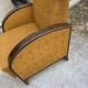 Art Deco armchair from the 1920s in straw yellow fabric and dark wood, with curved armrests.