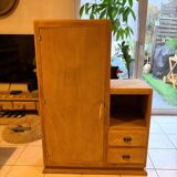 Asymmetrical cabinet made of raw wood