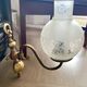 Pair of vintage wall sconces in brass and frosted engraved glass.