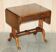 Antique extendable coffee table circa 1880 in solid walnut.