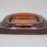 Empty-pocket in amber glass