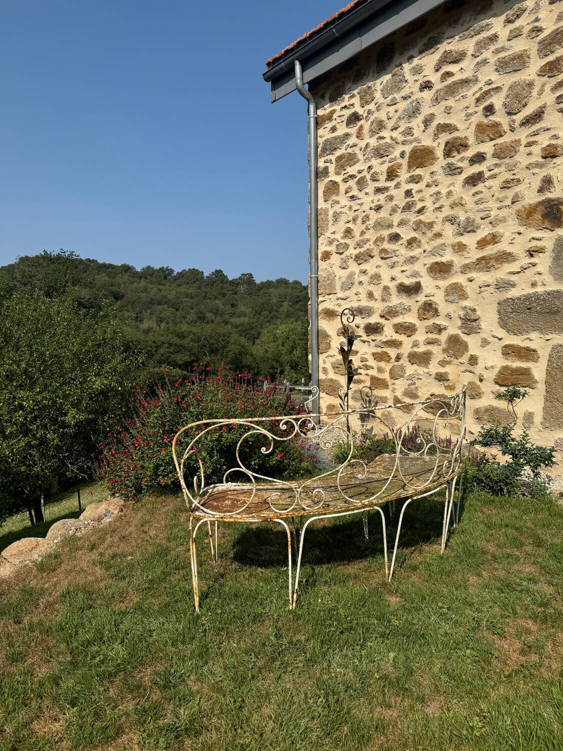 Wrought iron half-moon bench