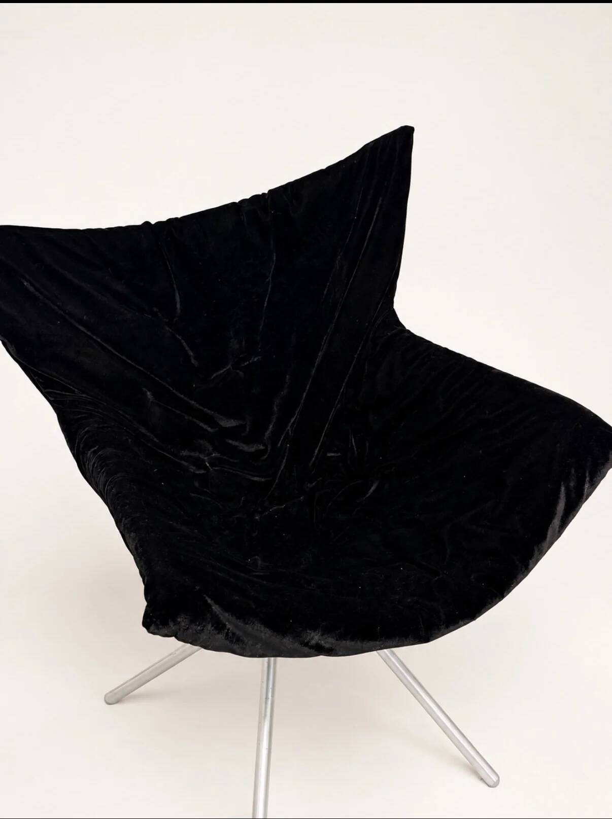 Vintage black velvet swivel lounge chair, sculptural butterfly shape.