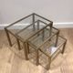 Set of 3 nesting tables in brass and glass. French work by Guy Lef.