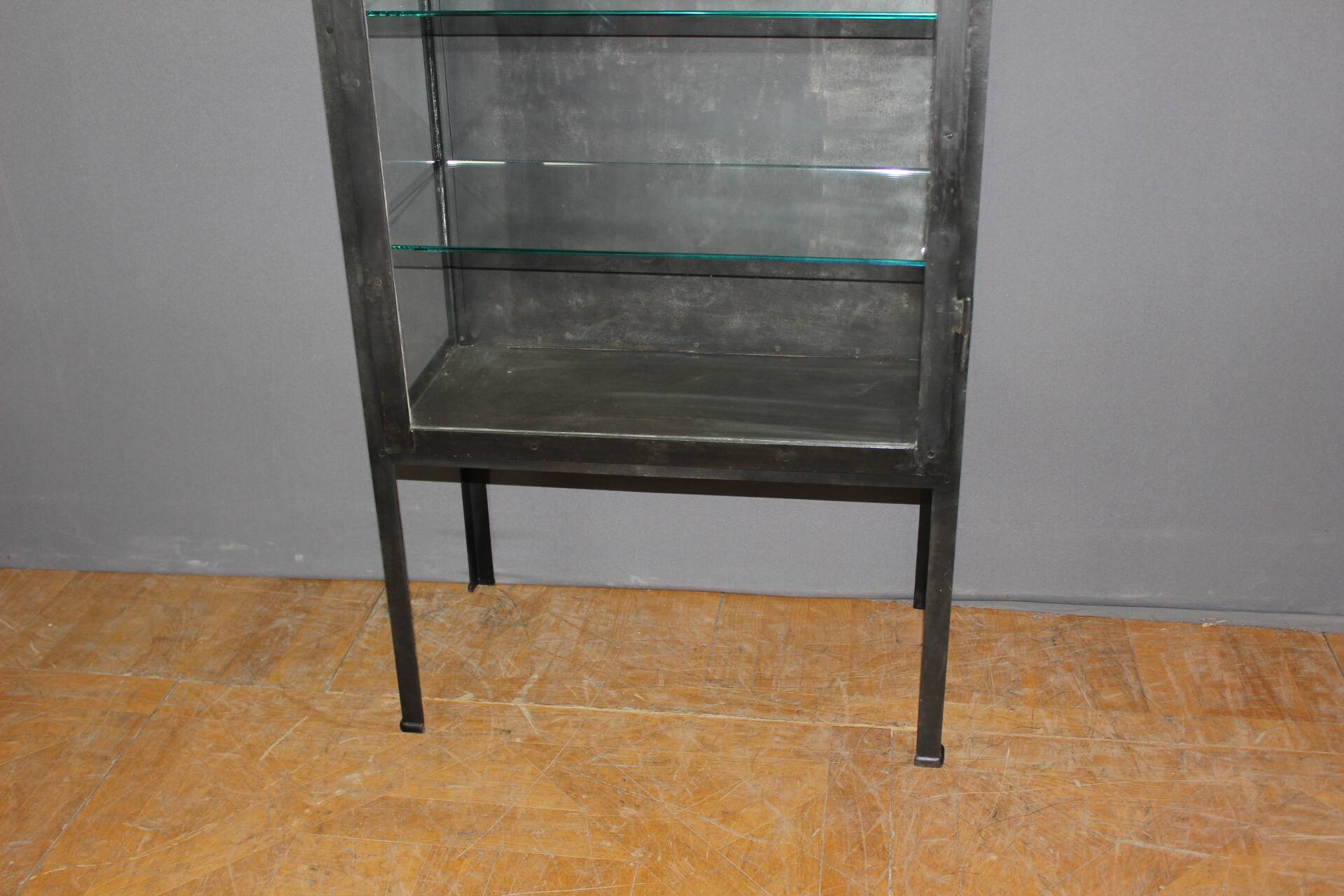 Iron display cabinet with black patina from around 1920