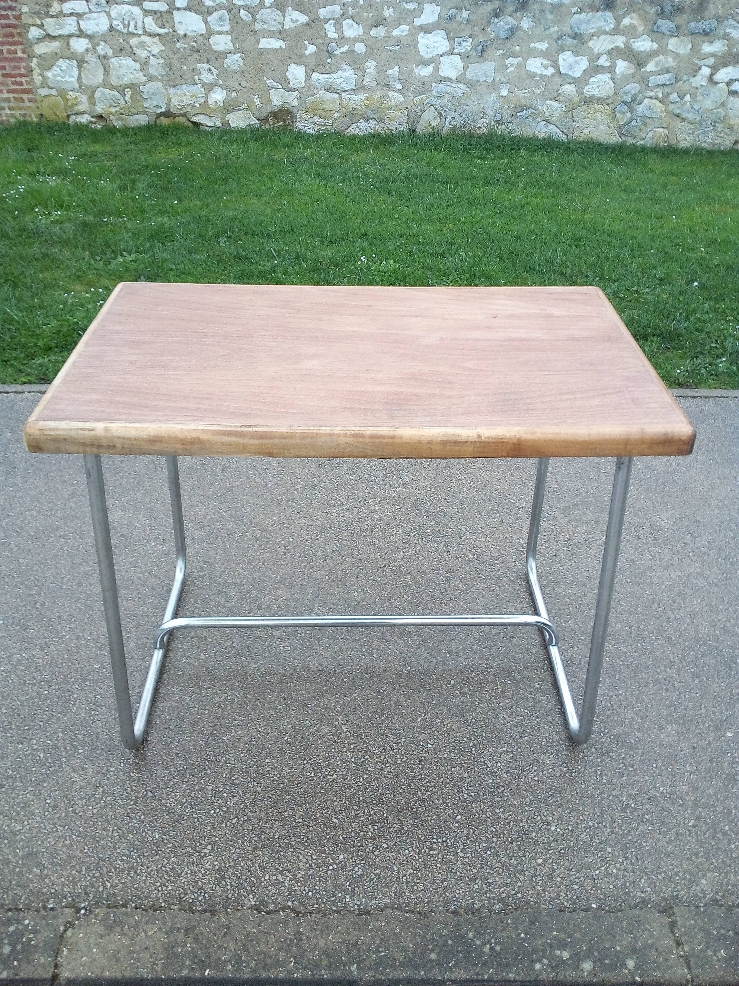 Old table in chrome steel and wood