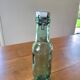 Vintage glass bottle l'Idéale with porcelain stopper