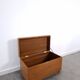 Vintage teak Danish chest with a lid on wheels, toy chest.