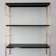 Modular string wall shelf in golden brass and black metal, 50s/60s