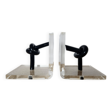 Bookends in plexiglass and knotted black tubes, 1980s design.