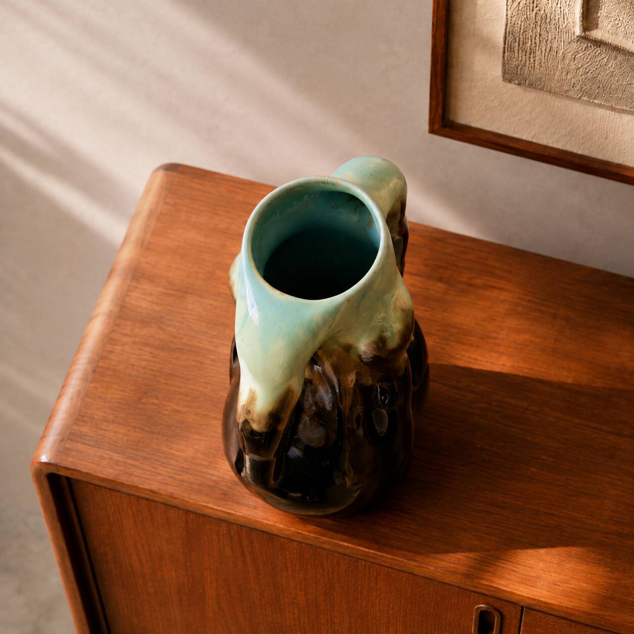 Rare ancient organic vase from Thulin in glazed flame pottery.