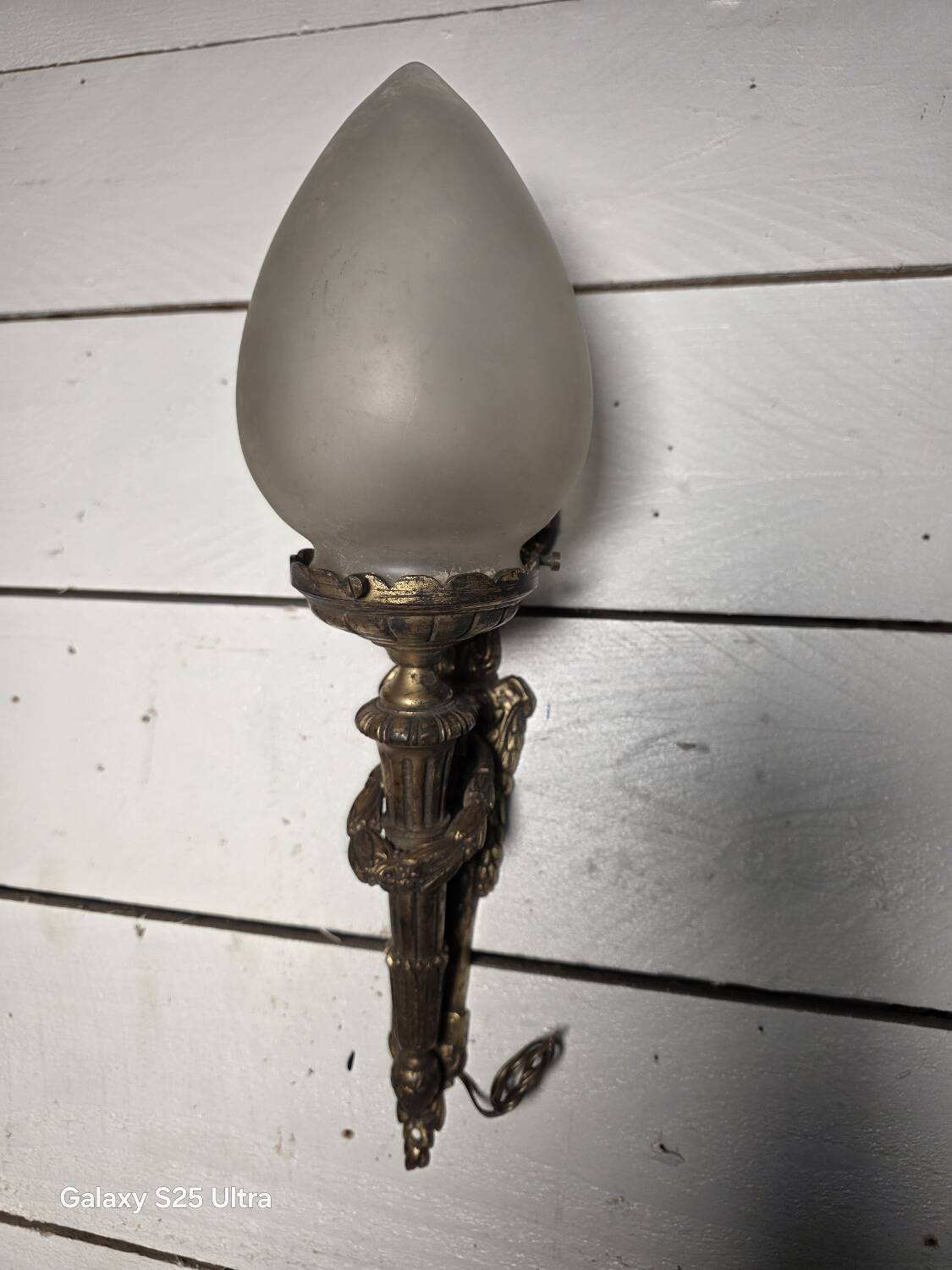 Pair of torch wall lights in Louis XVI style in 19th-century bronze.
