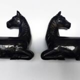 Black marble bookends with lying horses