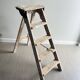 Former stepladder of patinated wood painter