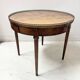 Louis XVI style bouillotte table in veneered wood, 20th century.