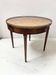 Table bouillotte de style Louis XVI en bois de placage XX siècle