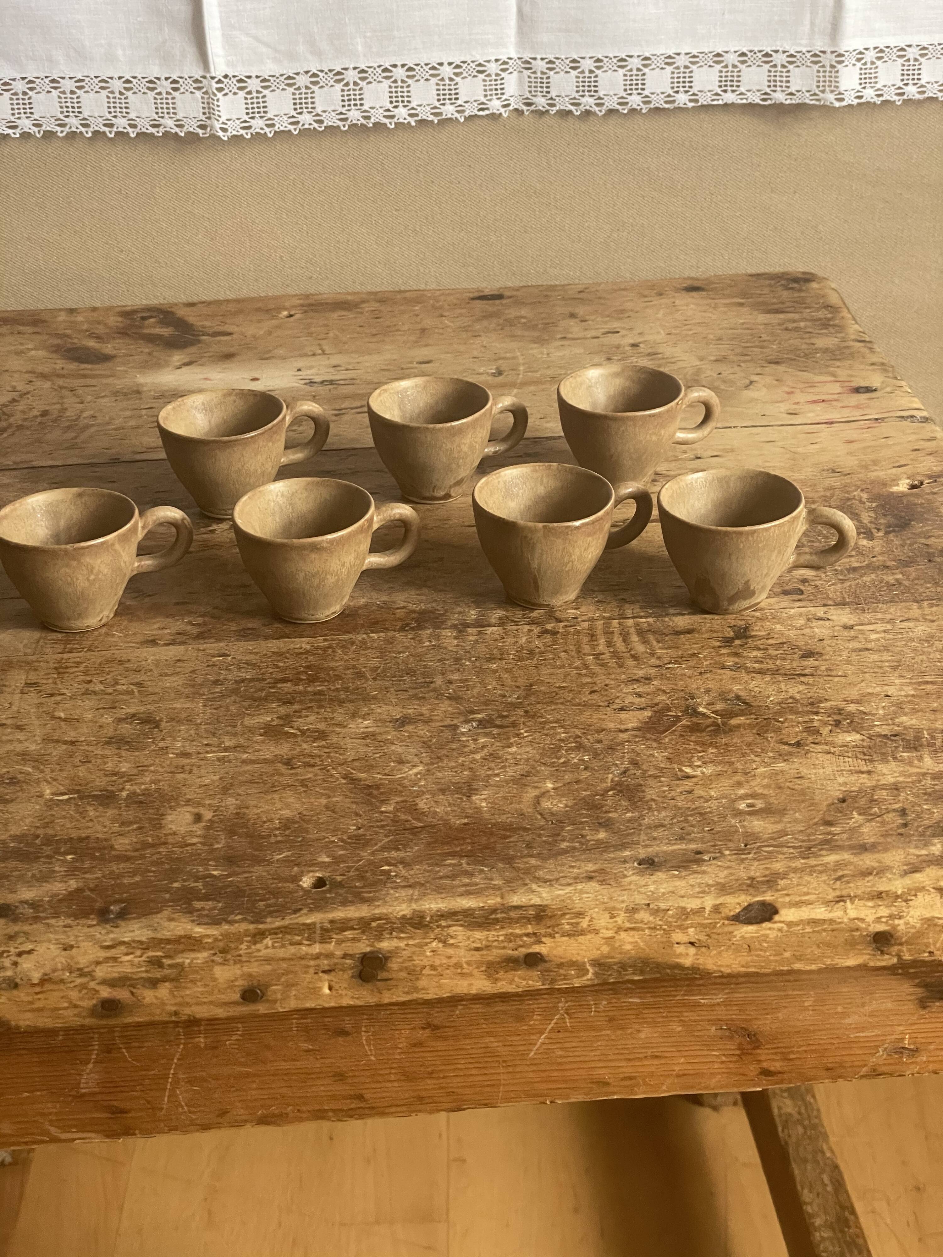 7 very small old sandstone coffee cups