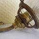Wall lamps, opaque corolla and iridescent ochre lampshade, brass and wood support