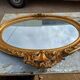 Oval mirror wood and gilded stucco 19th century