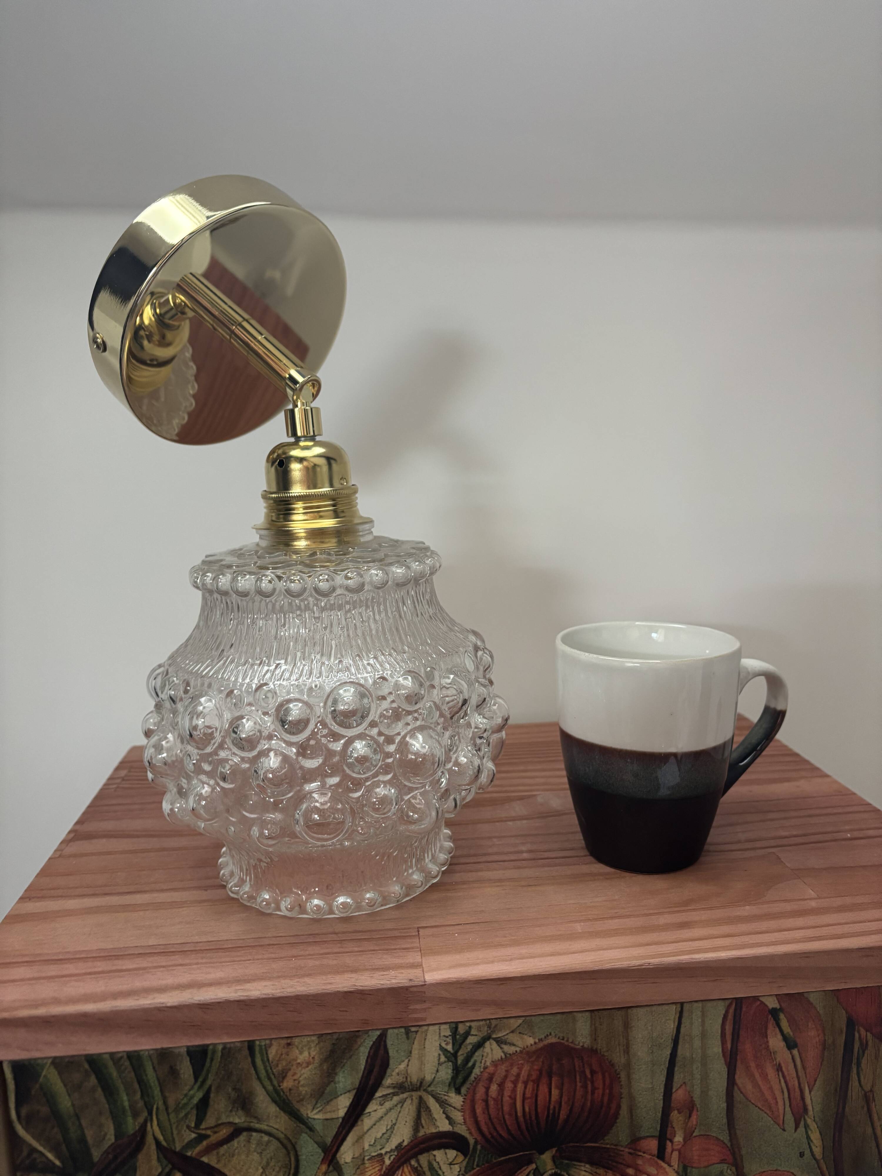 Gold wall light with bubble glass