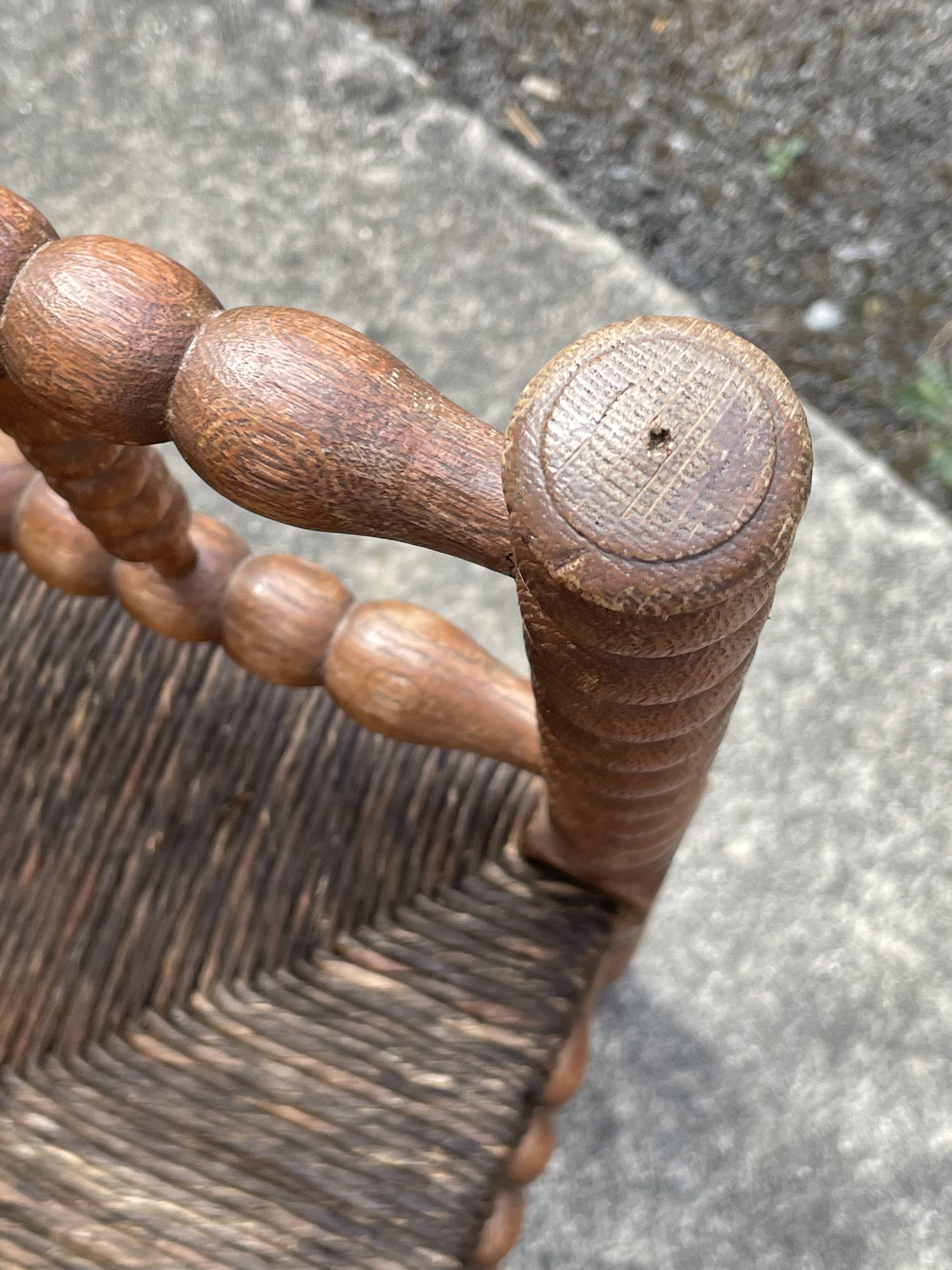 Antique Bobbin armchair with straw seat