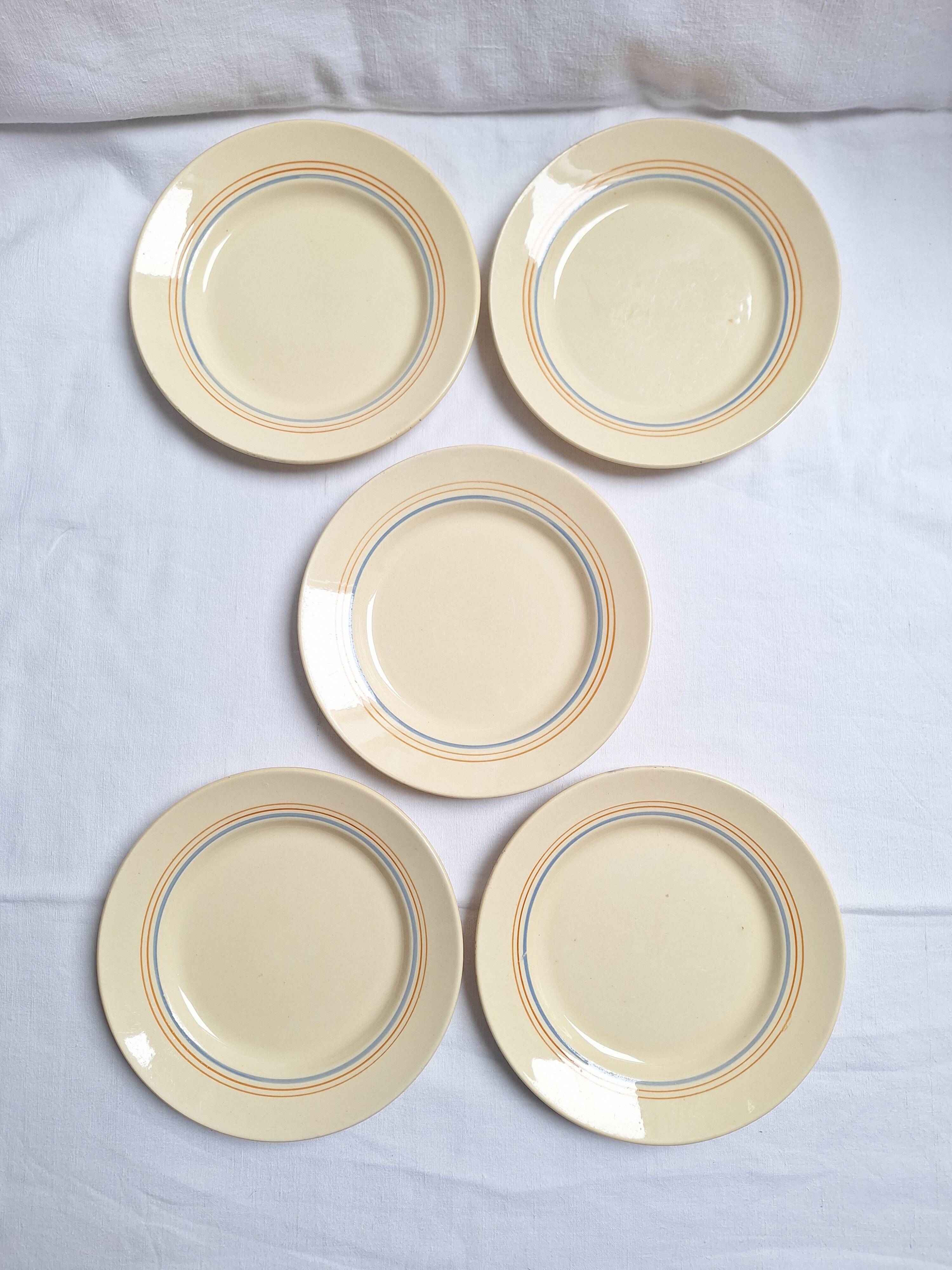 Vintage cream, orange and blue dinner plates.