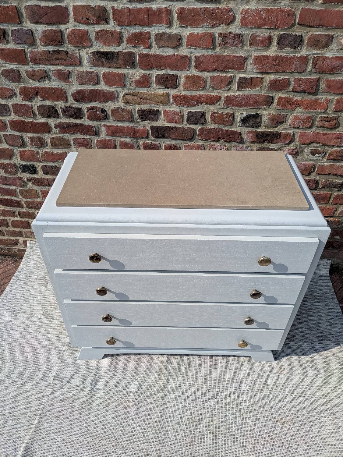 Marble-topped chest of drawers