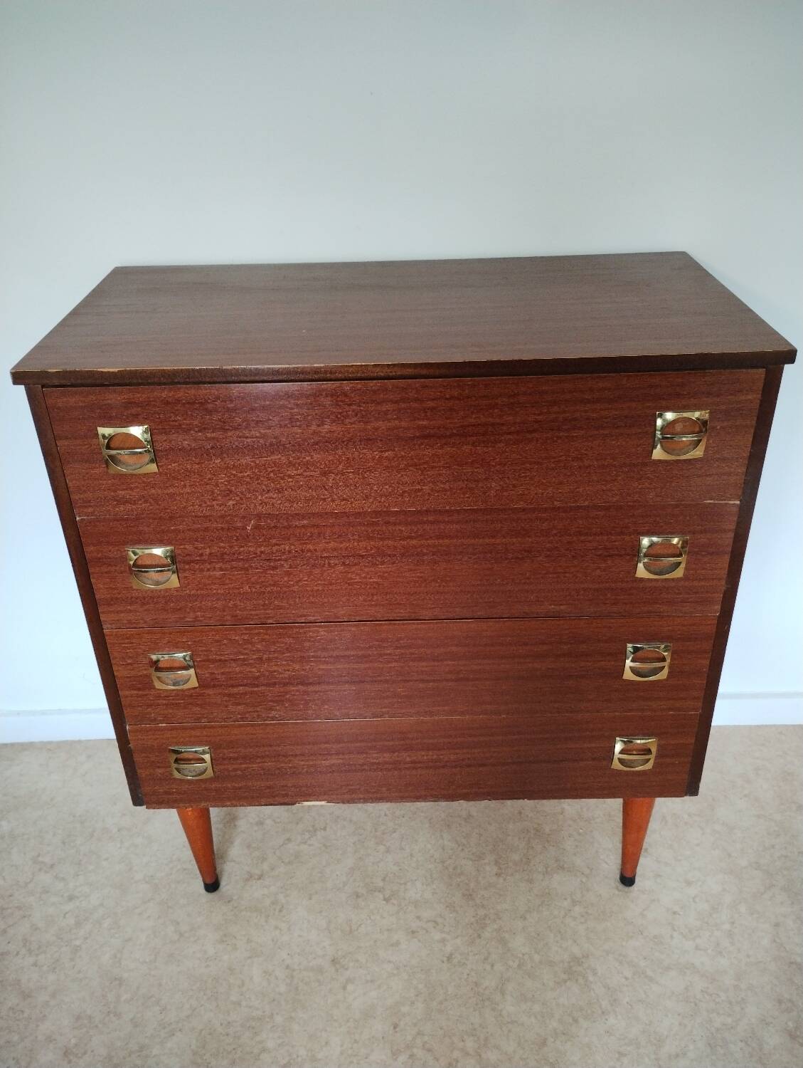 Chest of drawers with spindle legs