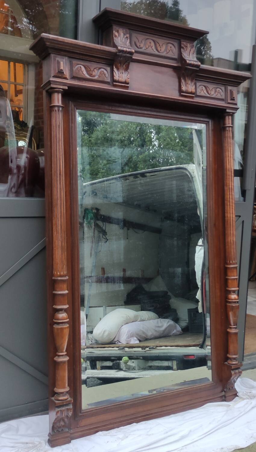 Old large carved wooden mirror