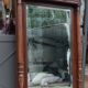 Old large carved wooden mirror