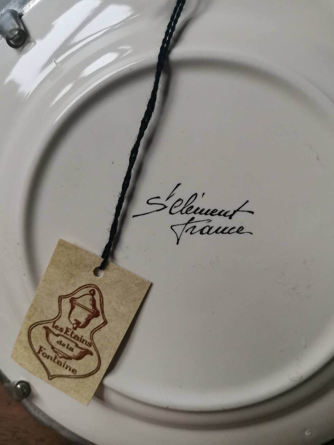 Vintage St Clément plate to hang with pewter frame stamped pewter of the fountain France