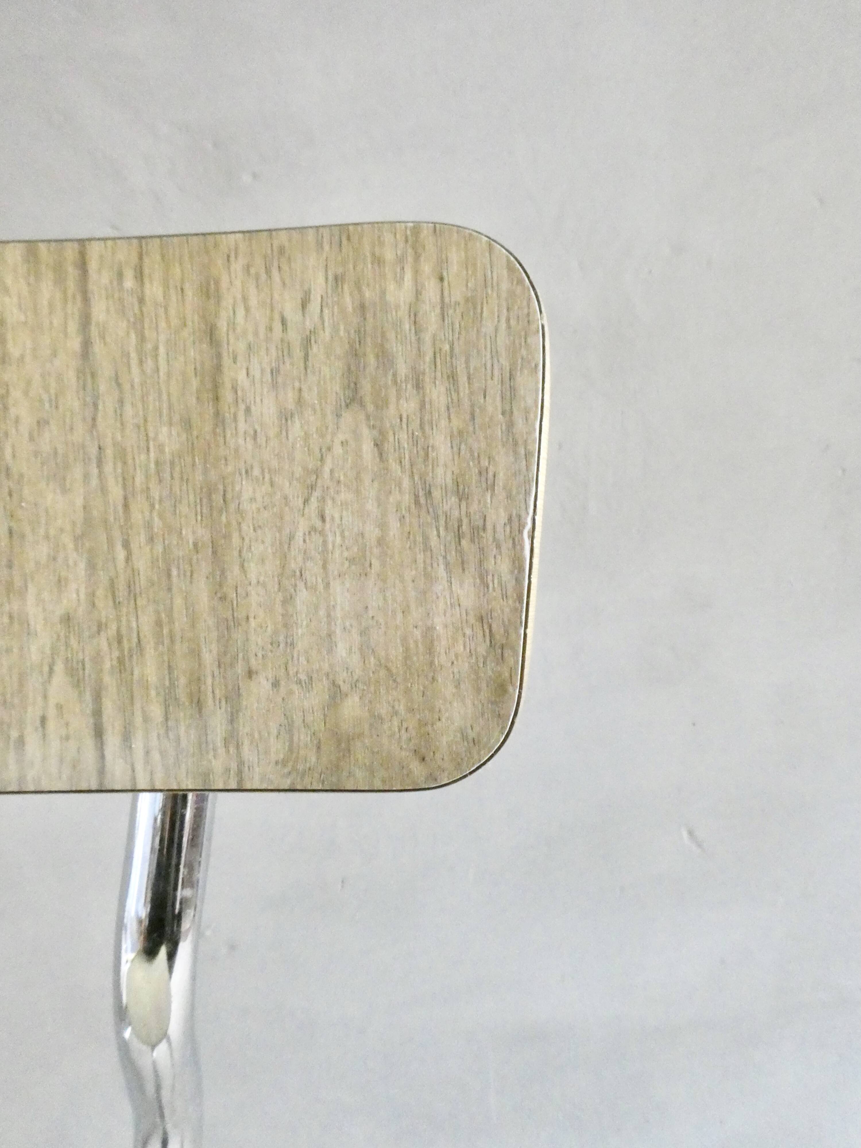 Pair of chairs in "wood" formica and gold edges, 1960s