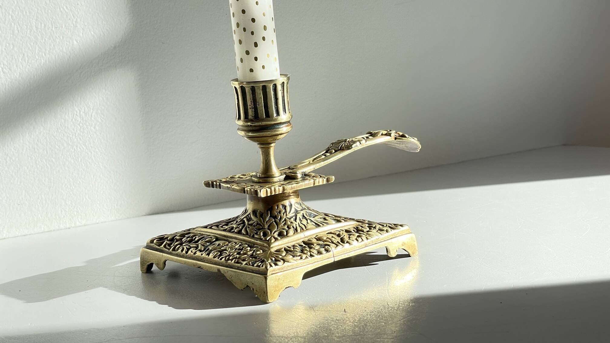 Patterned solid bronze hand candle holder