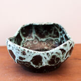 Empty pocket in black ceramic with green drip