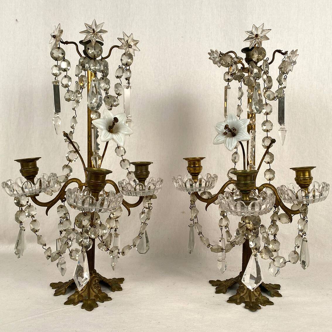 Pair of candlesticks with tassels and flowers in white porcelain
