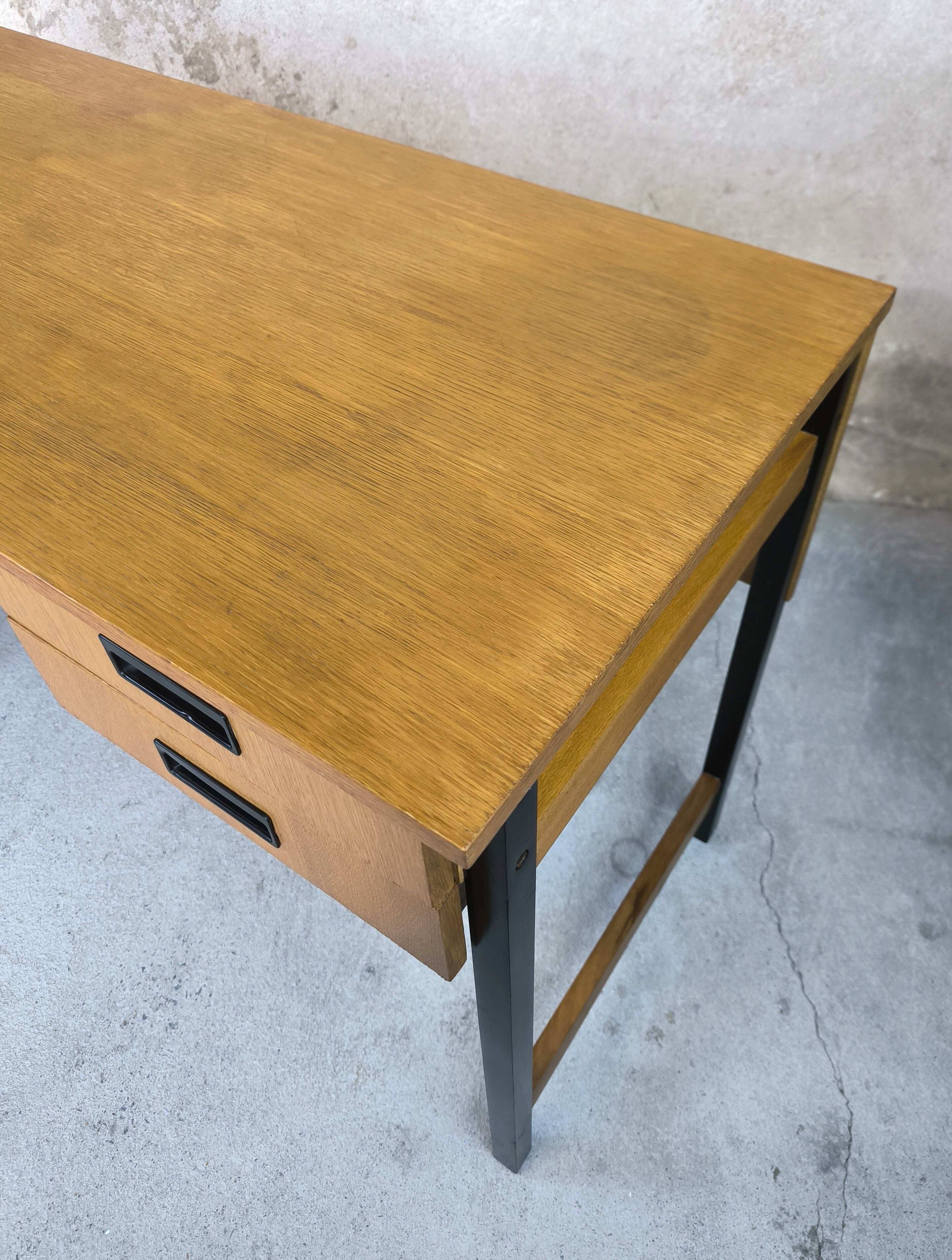 Vintage desk in modernist style made of wood.