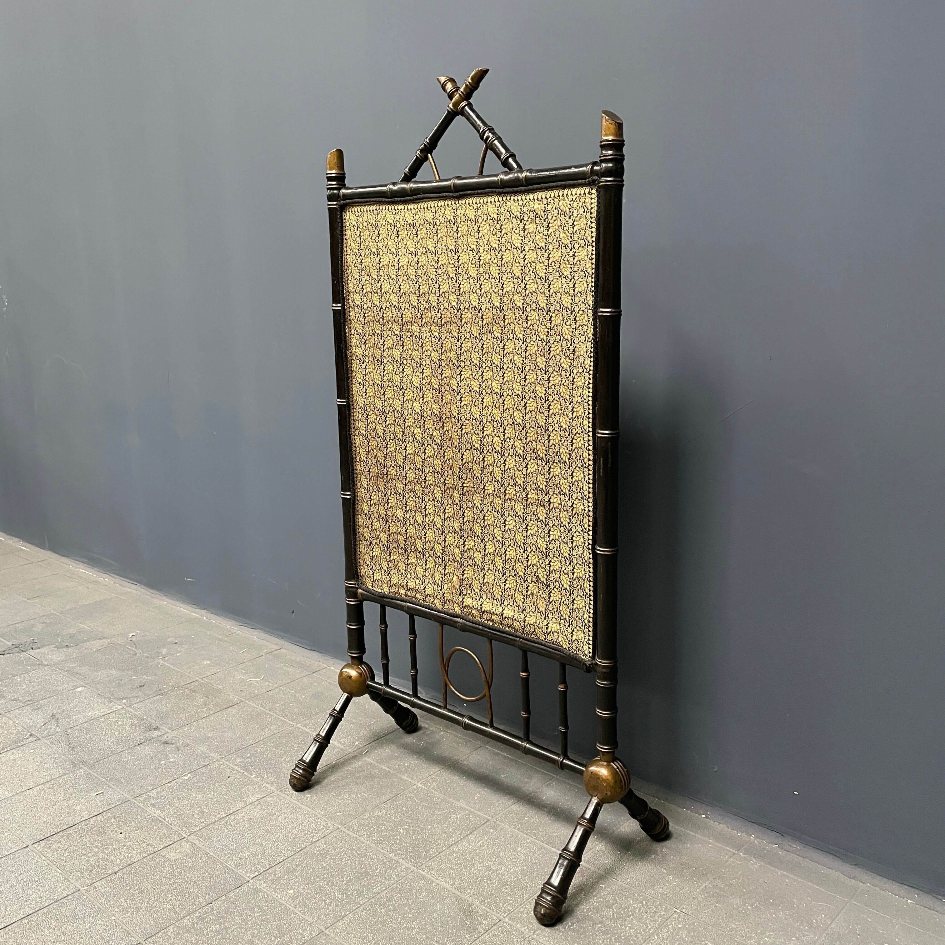 Antique black and gold faux bamboo fireplace screen