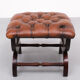 English country house style padded leather ottoman
